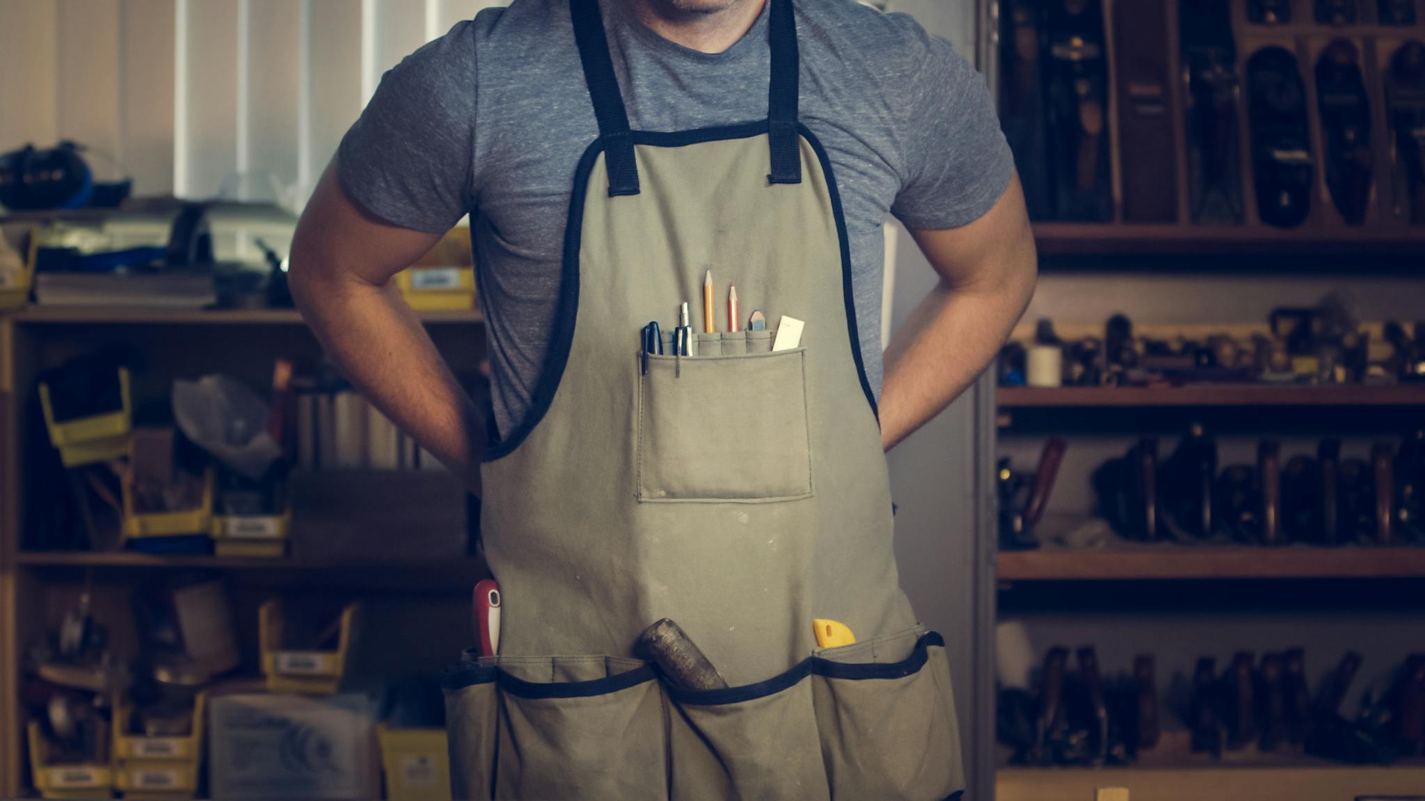close up of a craftsperson with tools in